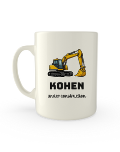 White mug printed with a digger above a child's name